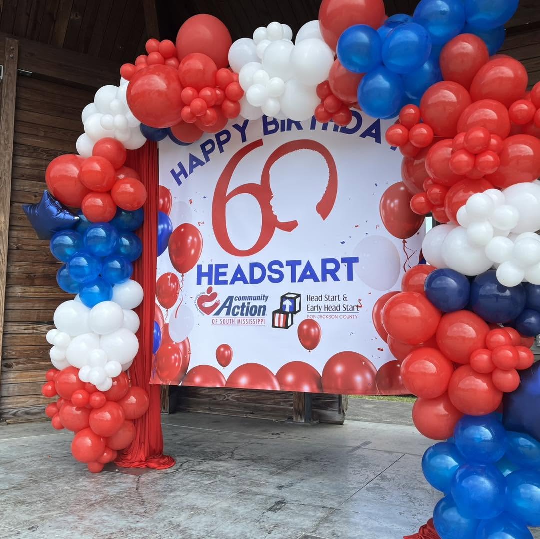 Printed event banner styled with balloons