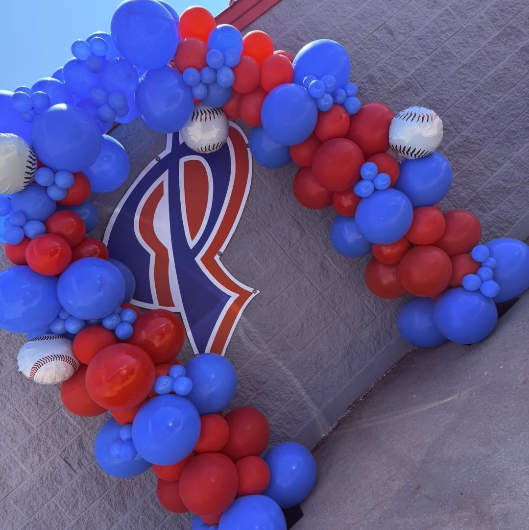 Red, white and blue balloon wreath with baseball accents and a team logo