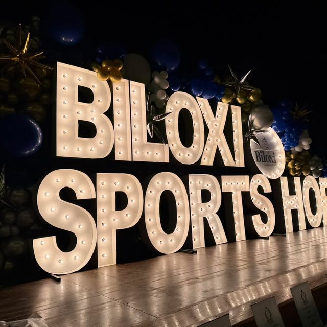 Illuminated Biloxi Sports Hall of Fame marquee letters on stage