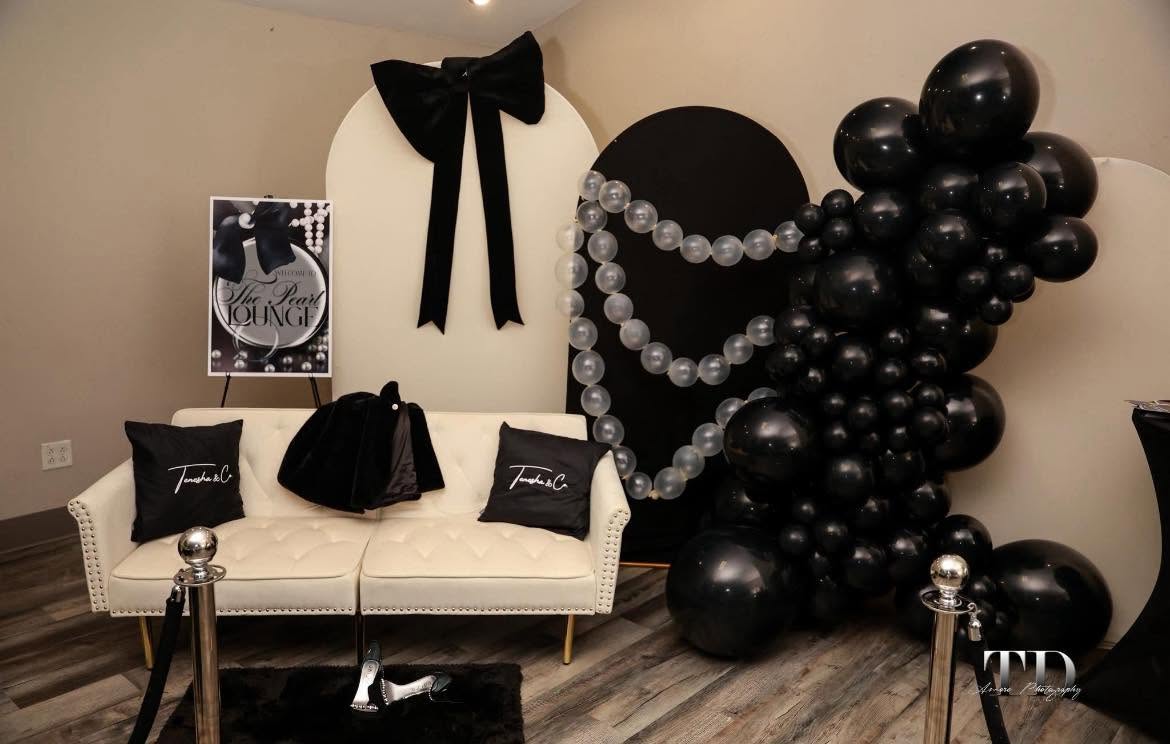 Black balloon and pearl lounge installation